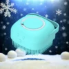 Silicone pet bath brush with soft bristles and shampoo dispenser in a winter-themed background